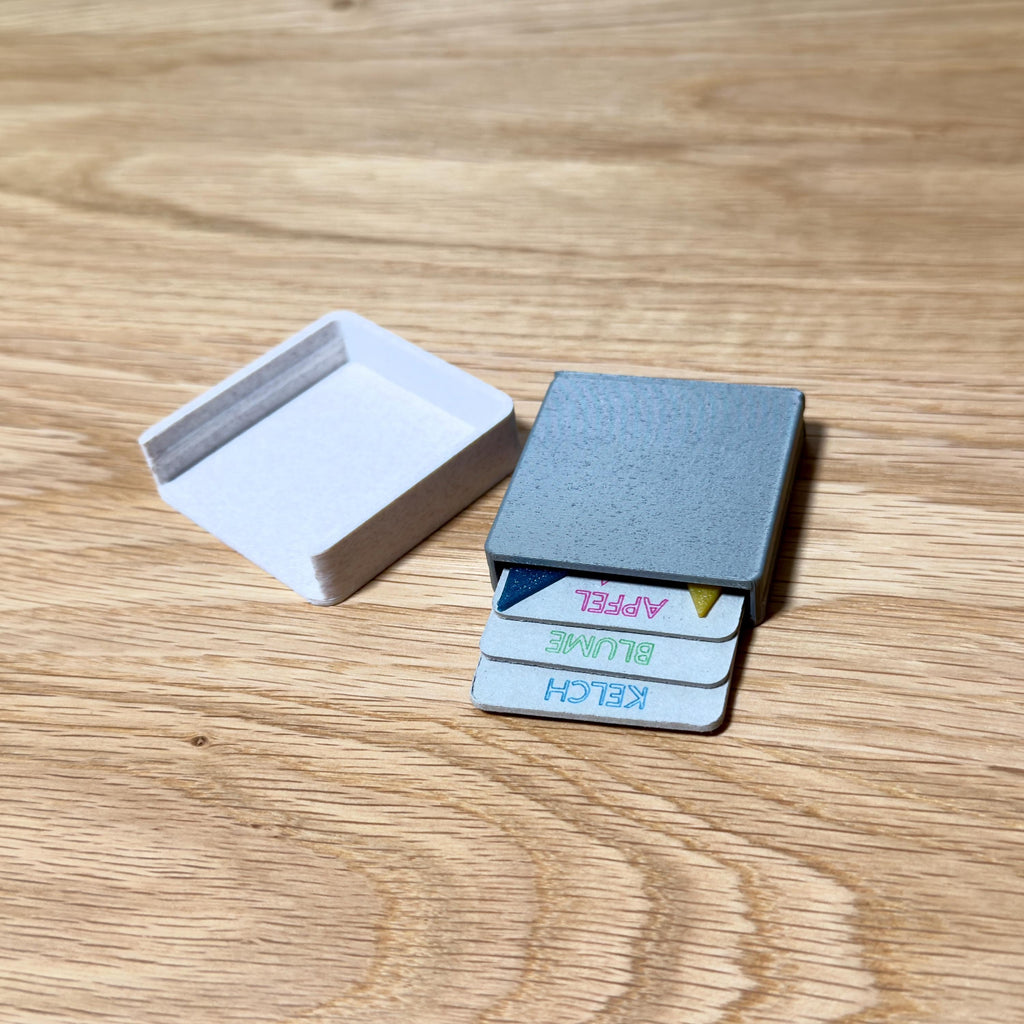 Tangram Reisespiel – 3D-gedrucktes Mini-Knobelspiel mit Aufbewahrungsbox & optionalem Schlüsselanhänger, Logikspiel to go, Geschenkidee